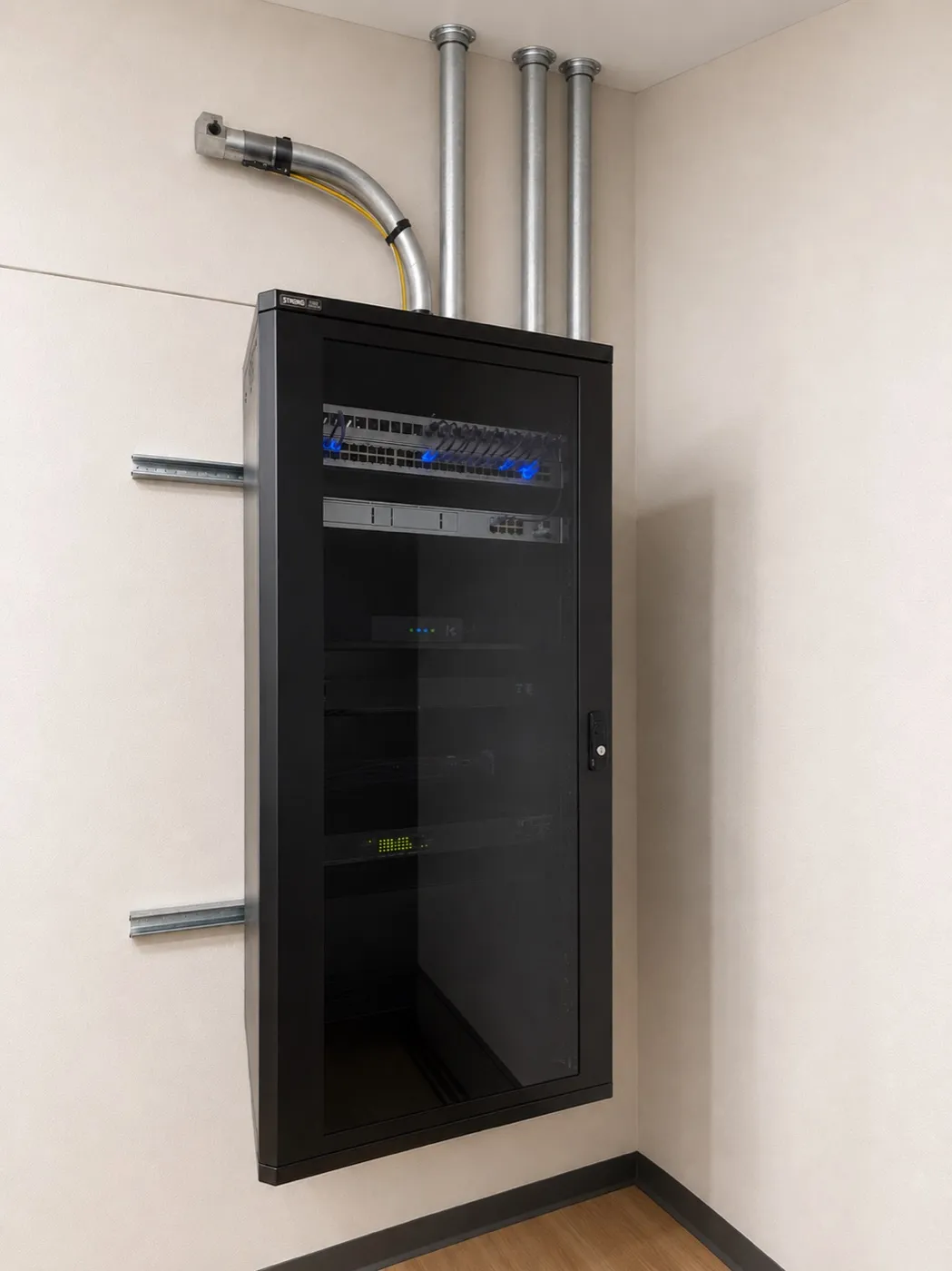 A wall-mounted network rack with patch panel, switch and labeled cabling